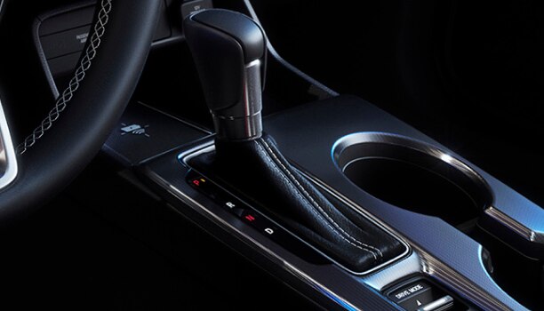 Closeup of a gearshift in the cabin of a hatchback