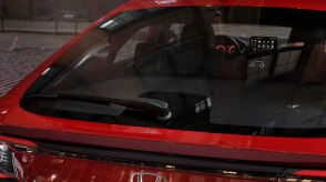 Closeup of hatch door on a red Hatchback. 