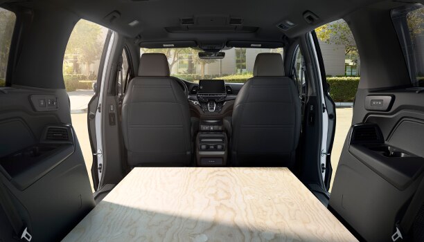 Interior view of Odyssey packed with sheets of plywood.