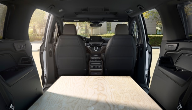 Interior view of Odyssey packed with sheets of plywood.