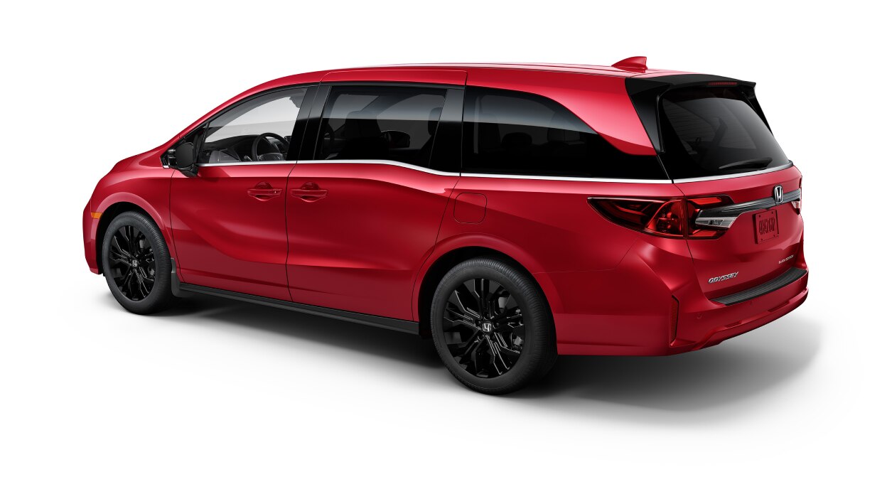 3/4 rear side view of red Odyssey on white space.