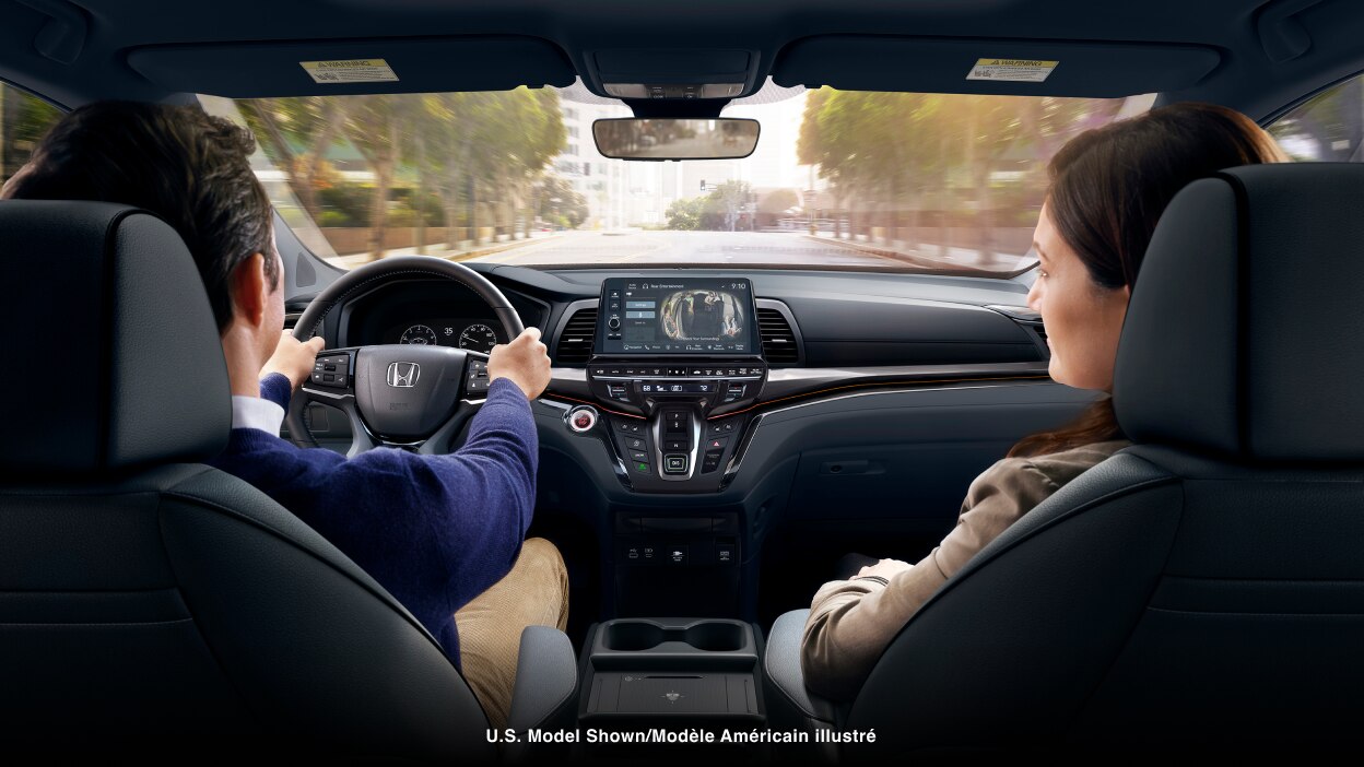 Interior view from behind a couple in the front seats.