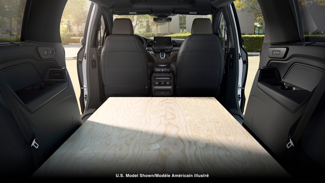 Interior view of Odyssey packed with sheets of plywood.