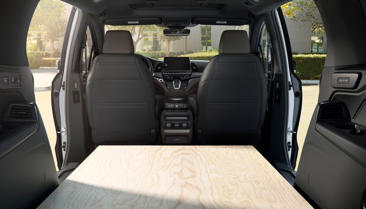 Interior view of Odyssey packed with sheets of plywood.