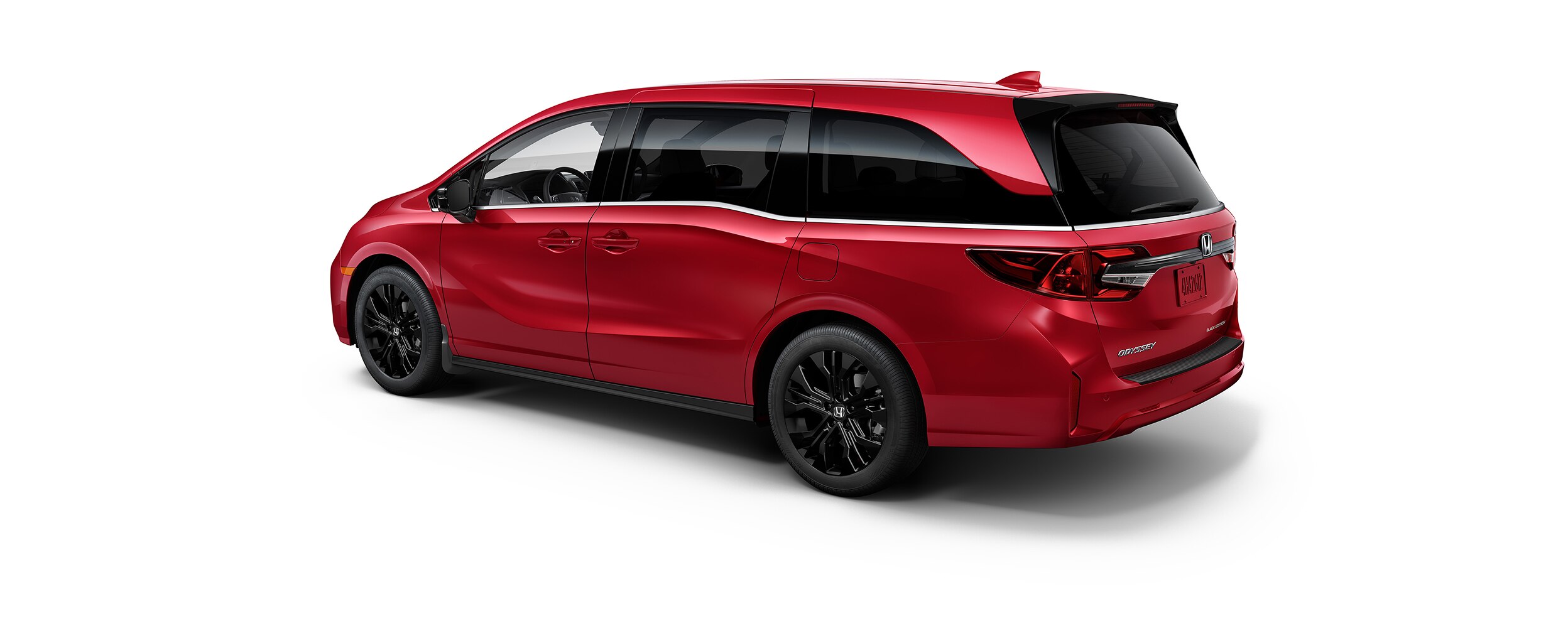 3/4 rear side view of red Odyssey on white space.