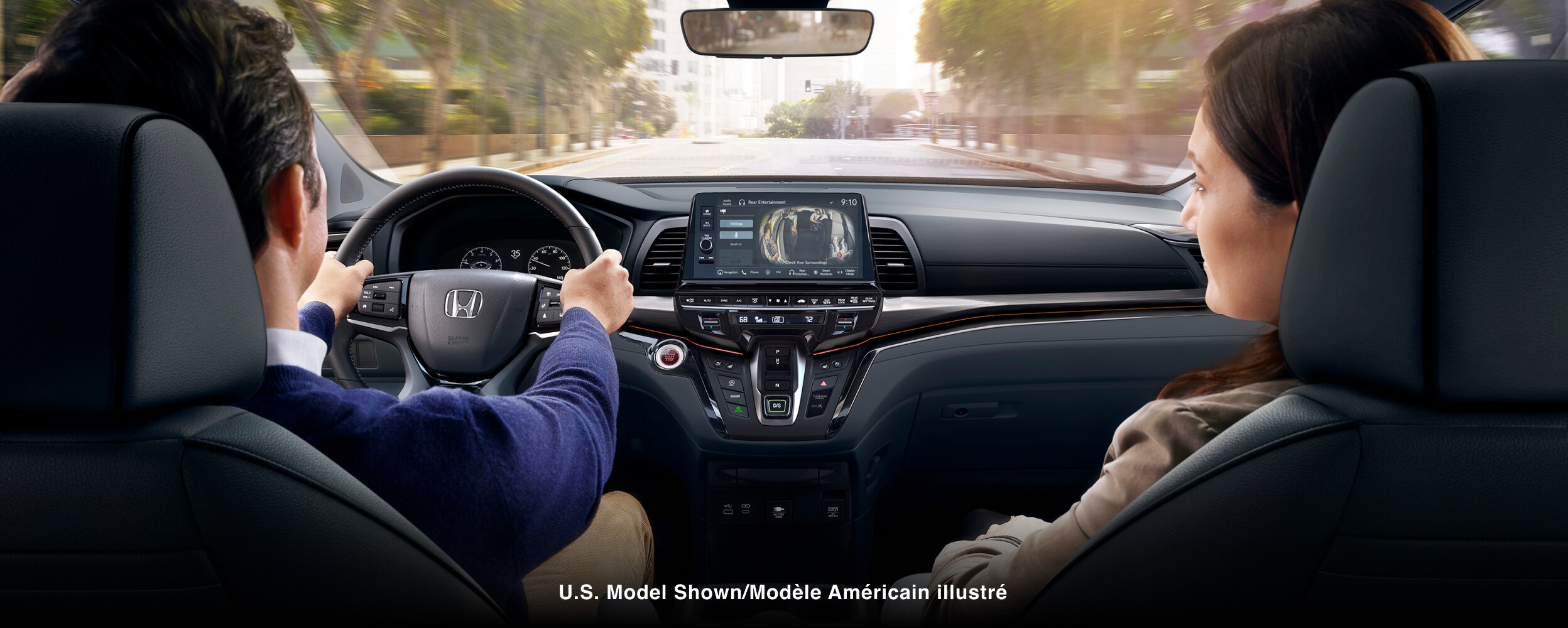 Interior view from behind a couple in the front seats.