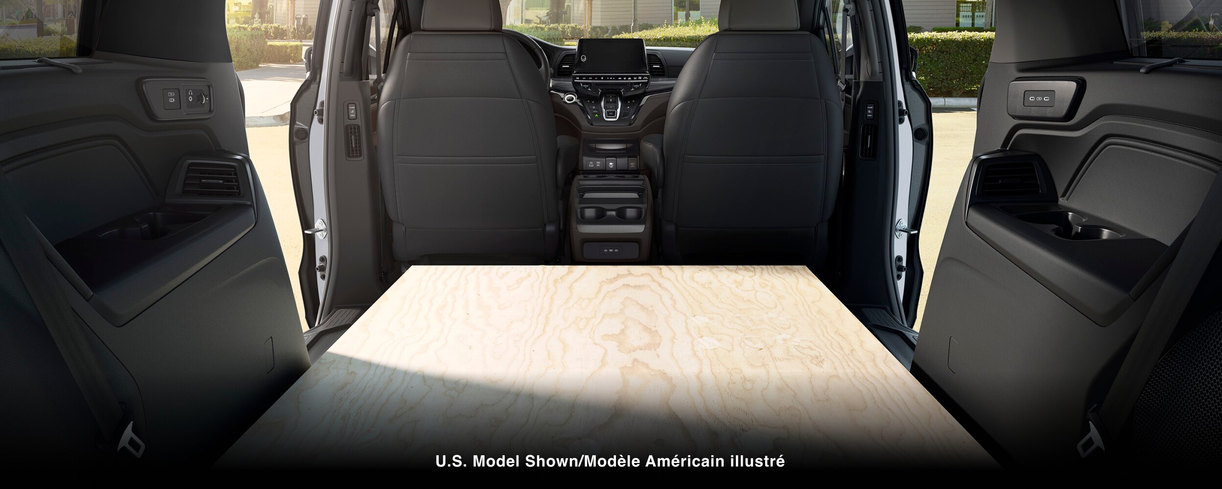 Interior view of Odyssey packed with sheets of plywood.