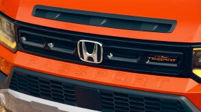 Close up of front grille on an orange Passport. 