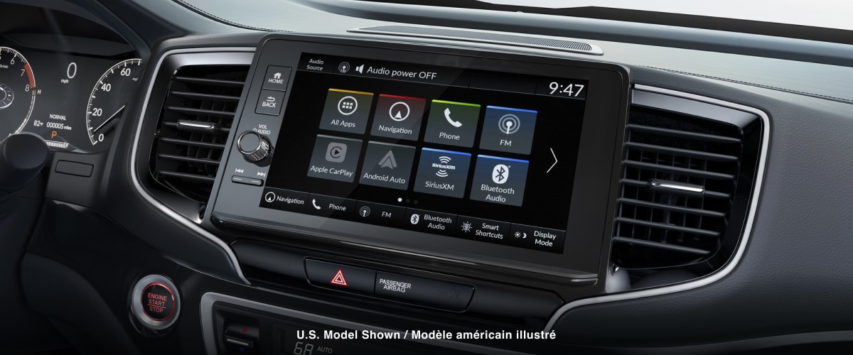 Closeup of touch-screen centre display’s homepage on touchscreen.