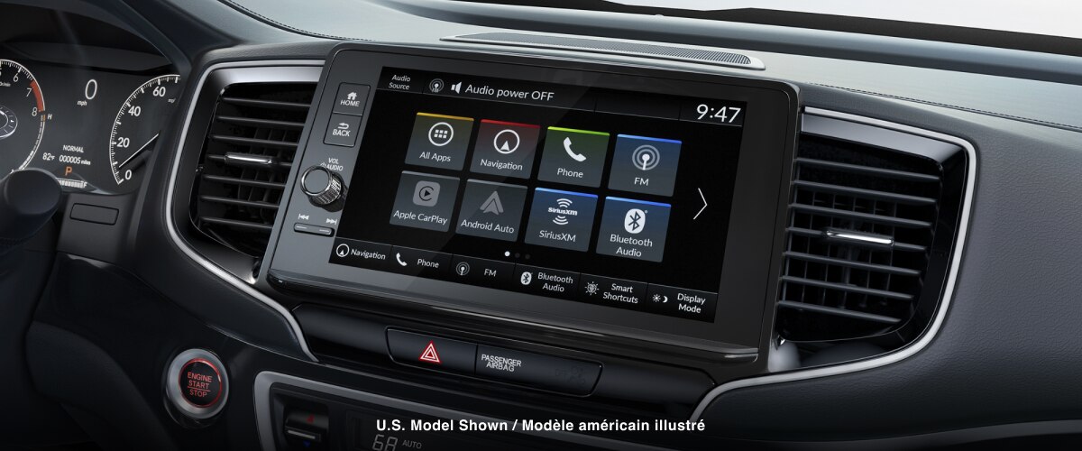 Closeup of touch-screen centre display’s homepage on touchscreen.